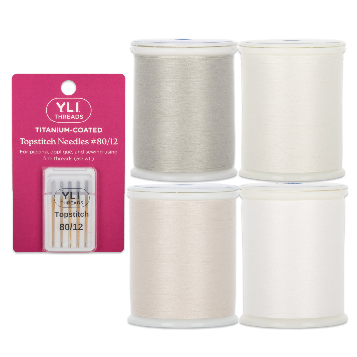 A set of four spools of YLI Dream Seam cotton piecing thread in light neutral colors, accompanied by a pack of #80/12 Titanium-coated Topstitch Needles.