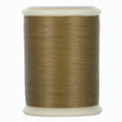 Spool of brown hand quilting thread on a white background