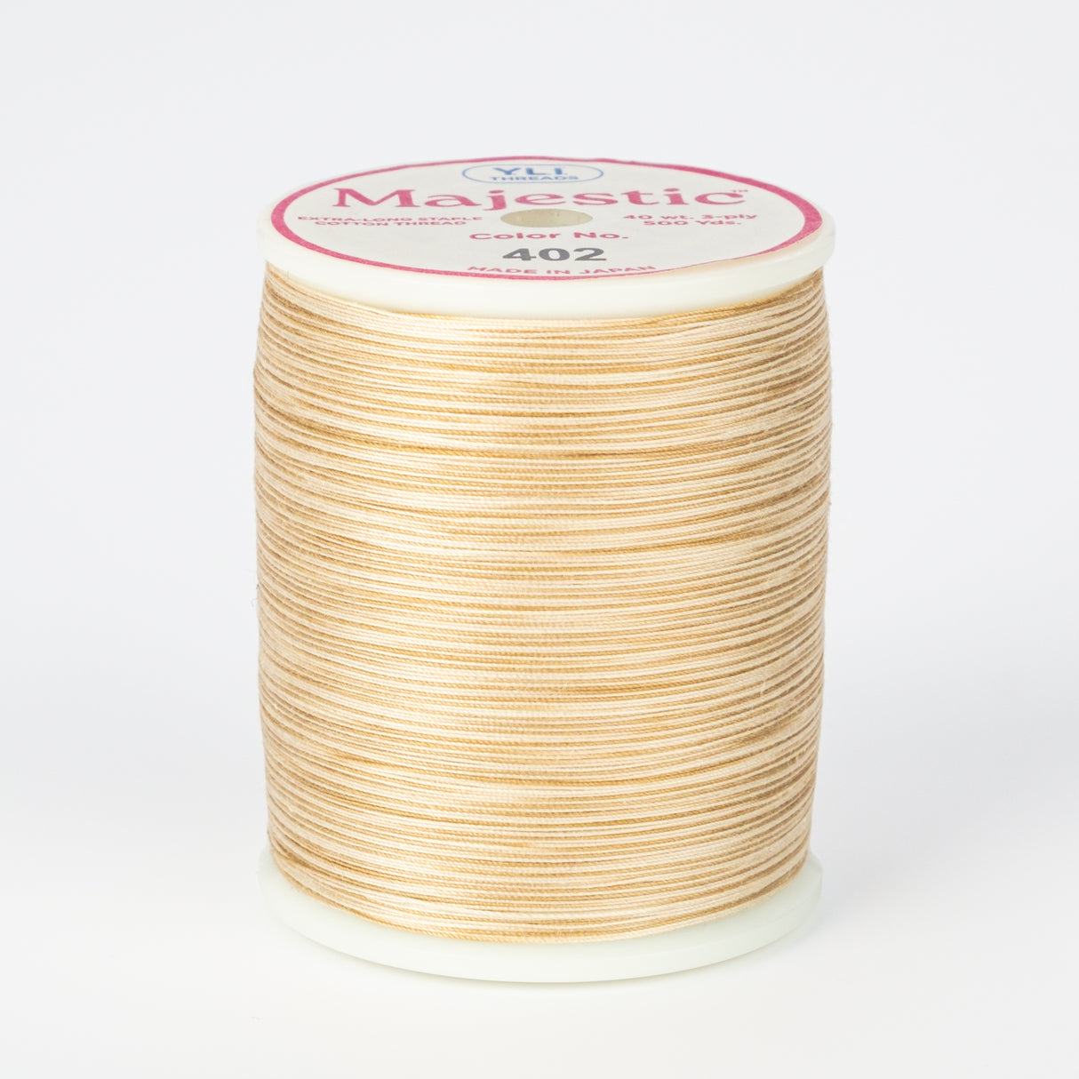spool of majestic cotton quilting thread #402 sand dollar