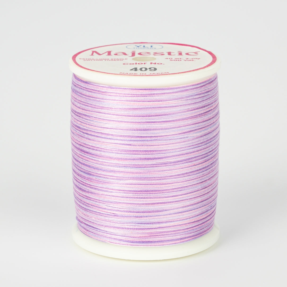 spool of majestic cotton quilting thread #409 wild orchid