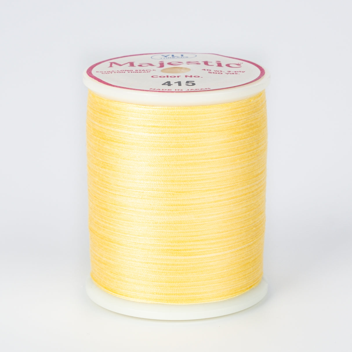 spool of majestic cotton quilting thread #415 lamplight