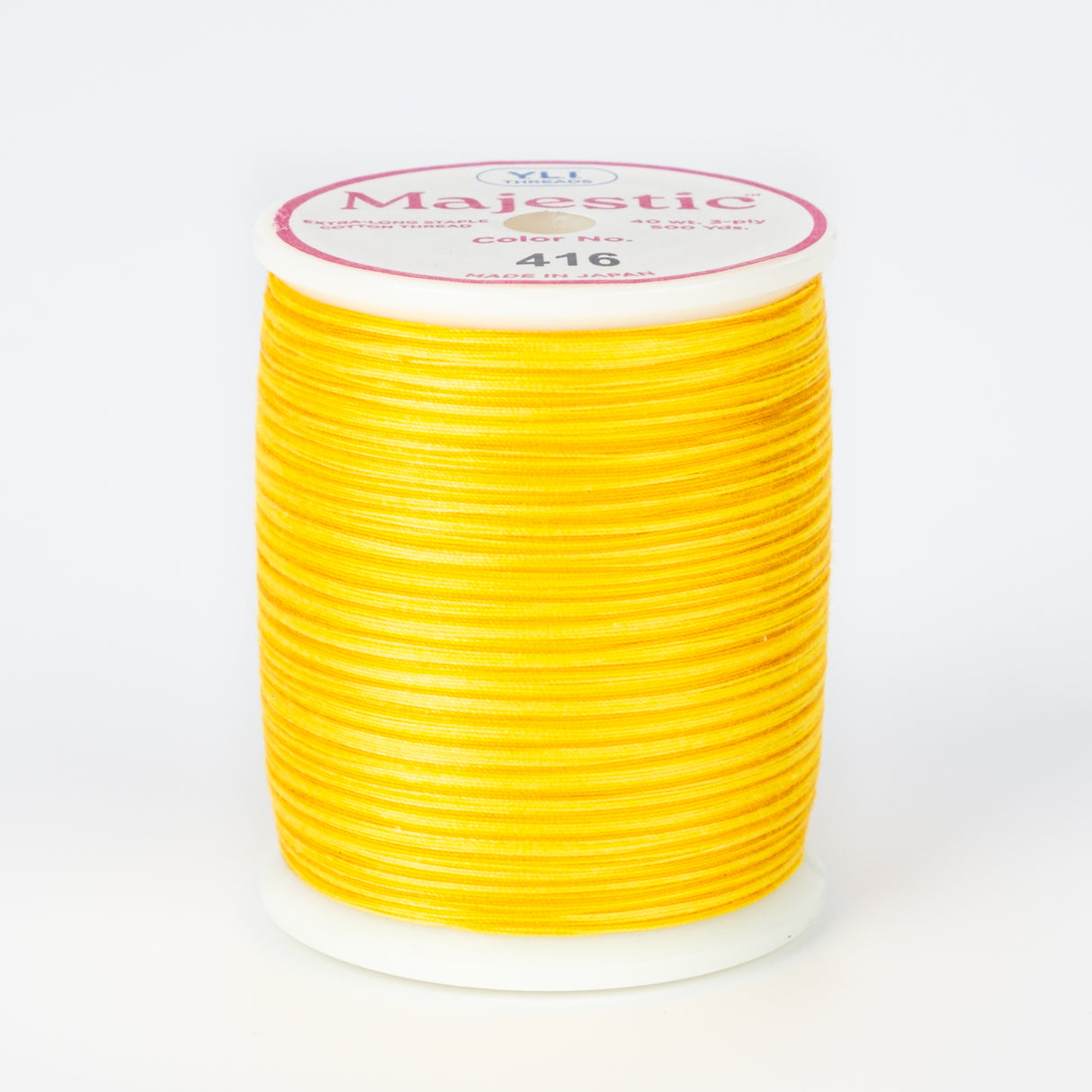 spool of majestic cotton quilting thread #416 radiant