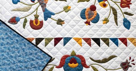 wholecloth quilt hand quilted with yli hand quilting thread