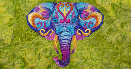 Colorful embroidered elephant design on a textured green fabric background