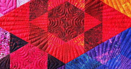 Colorful quilt topstitched with Elite trilobal polyester thread