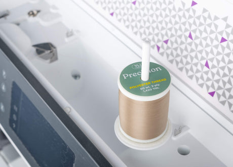 spool of Precision 60 wt polyester thread on sewing machine