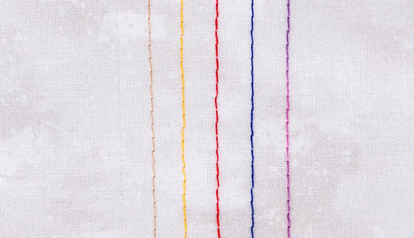 Threads of different weights stitched onto fabric