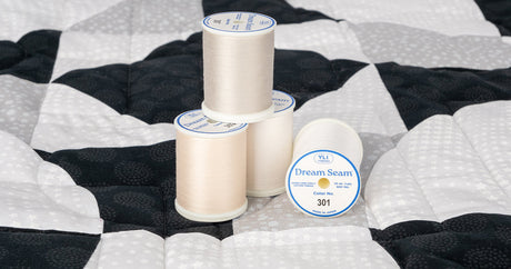 spools of dream seam 50 wt. cotton thread for piecing and quilting