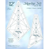 Clear acrylic quilting rulers in triangular wedge shapes with measurement markings and grid lines on light blue packaging.
