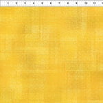 Yellow textured tonal fabric.