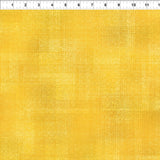 Yellow textured tonal fabric.