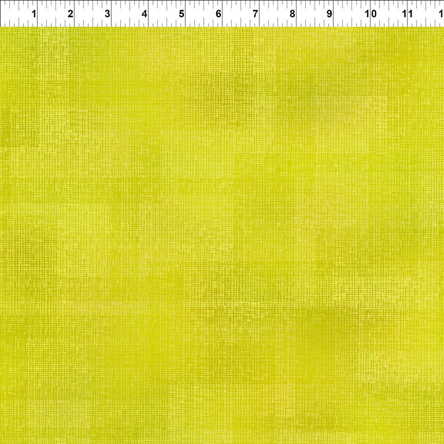 Yellow green textured tonal fabric.