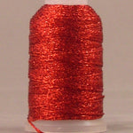 Red metallic thread on white plastic spool, shimmery finish with loose thread end visible