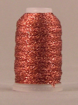 Melon colored metallic thread wound on white spool with shimmery copper-orange finish