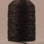 Black metallic thread wound on white plastic spool with visible sparkly texture and loose thread end