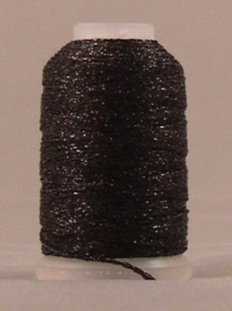 Black metallic thread wound on white plastic spool with visible sparkly texture and loose thread end
