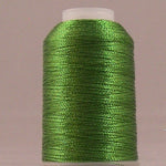 Spring green metallic thread wound on white plastic spool against neutral background