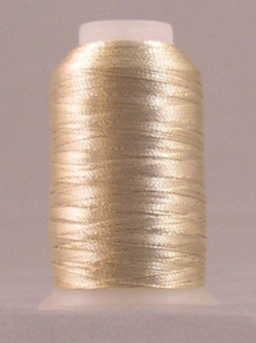 Champagne metallic thread on white plastic spool with lustrous gold finish