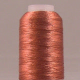 Terra cotta metallic thread wound on white plastic spool with shimmery copper-orange finish