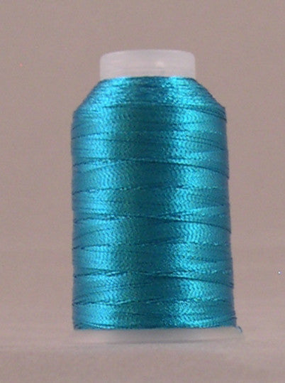 Sapphire blue metallic thread wound on white plastic spool with shiny finish