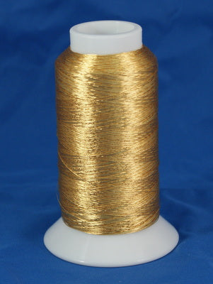Gold metallic thread on white plastic cone with blue background