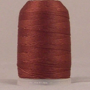 Brown jeans stitch thread on white plastic spool with neatly wound layers