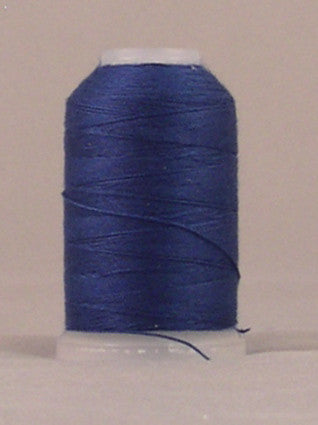 Navy blue 12 weight thread wound on white plastic spool with loose thread end visible