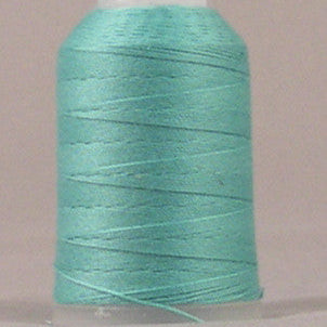 Sea foam green thread wound on white plastic spool with visible thread layers and loose end