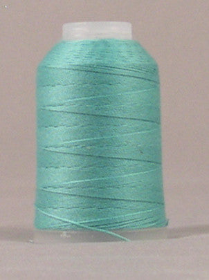 Sea foam green thread wound on white plastic spool with visible thread layers and loose end