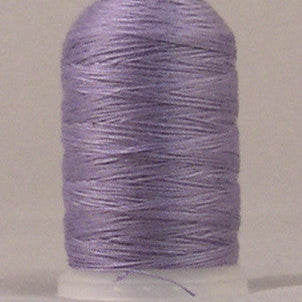 Orchid purple thread wound on white plastic spool with clean, even wrapping