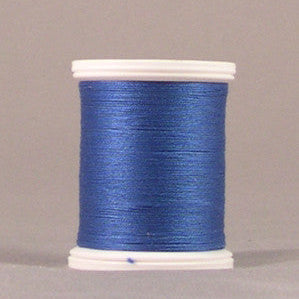 Blue thread spool with white plastic ends, showing neatly wound metallic blue thread