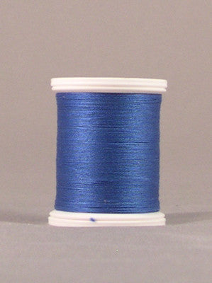 Blue thread spool with white plastic ends, showing neatly wound metallic blue thread