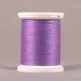 Lavender purple thread wound on white plastic spool against neutral background