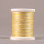 Yellow thread wound on white plastic spool with visible thread texture and clean edges