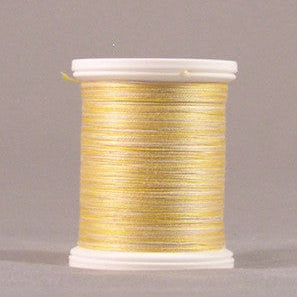 Yellow thread wound on white plastic spool with visible thread texture and clean edges