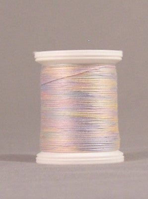Variegated pastel thread in pink, purple, and yellow tones wound on white plastic spool
