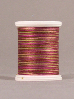 Burgundy and gold variegated thread on white plastic spool with visible thread wrapping