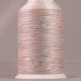 Morning Glory variegated thread on white cone with YLI brand label, showing soft pink, peach and gray multicolored strands