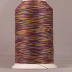 Multicolored variegated thread in burgundy, gold, and green tones wound on white plastic cone spool
