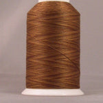 Brown thread wound on white plastic cone spool against neutral background