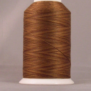 Brown thread wound on white plastic cone spool against neutral background