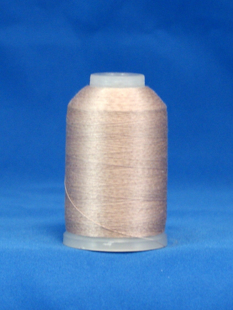 Light taupe thread wound on mini cone spool with white plastic top and clear base against blue background