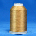 Light brown 60 weight thread on white plastic cone against blue background