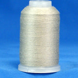 Gray thread wound on white plastic cone against blue background