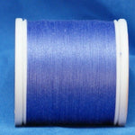 Lilac purple thread wound on white plastic spool against blue background