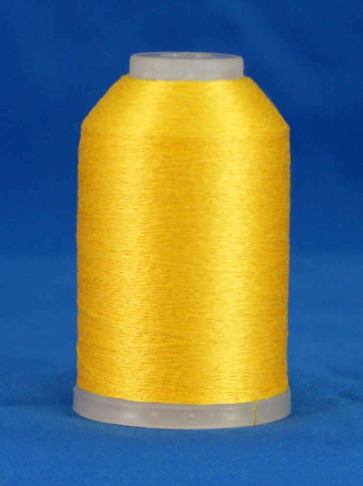 Bright yellow thread wound on white plastic cone against blue background