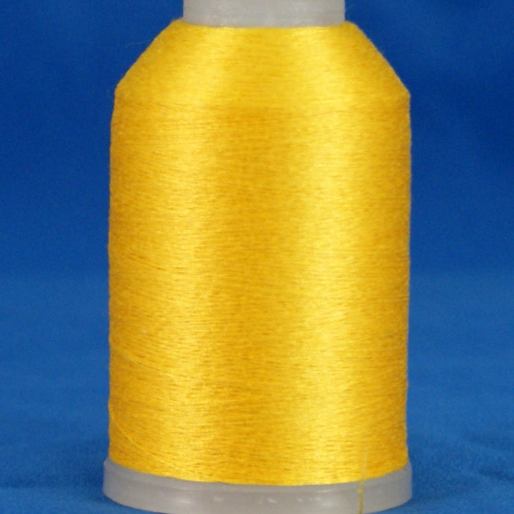 Bright yellow thread wound on white plastic cone against blue background