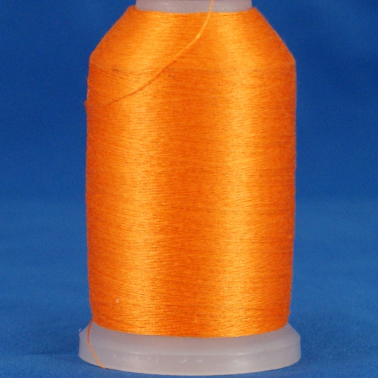 Orange thread wound on white plastic cone spool against blue background