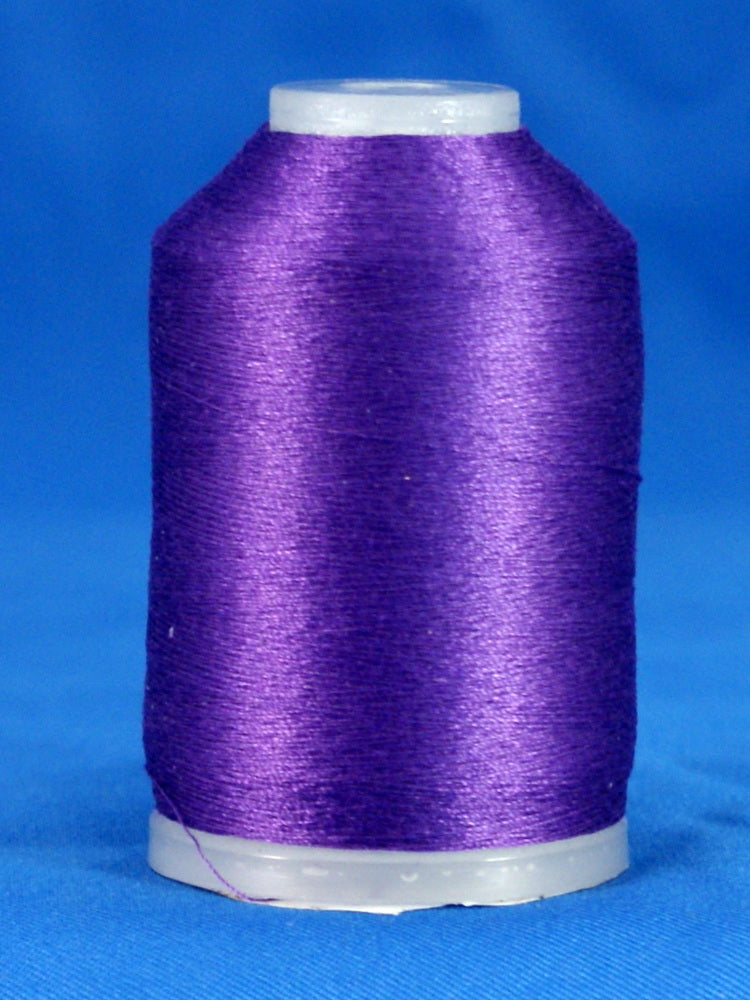 Purple embroidery thread wound on white plastic cone with tapered shape against blue background