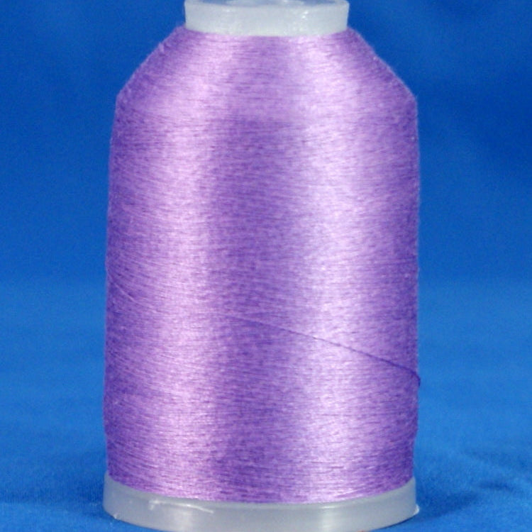Lavender purple thread wound on clear plastic cone against blue background